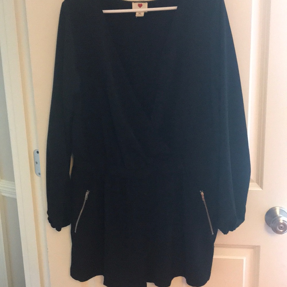 Black shorts romper. Long sleeve. Low cut